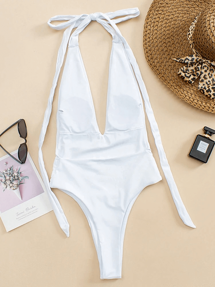 Sexy one piece swimsuit for women with open back in solid white, featuring high-quality nylon fabric. Perfect for stylish swimming.
